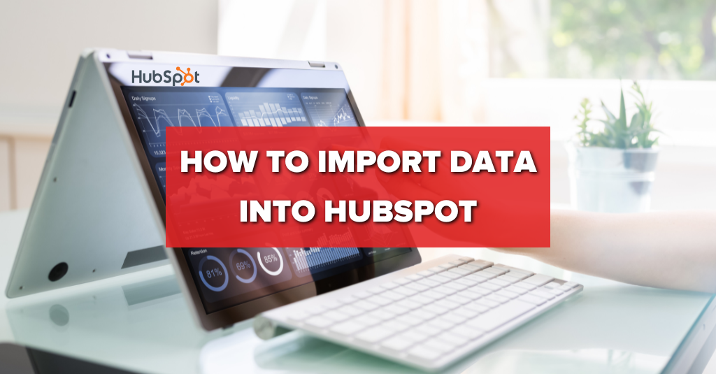 text "how to import data into hubspot" with laptop in background in office area